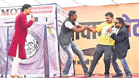 AAP’s Gopal Rai and Saurabh Bhardwaj participate in the launch of the ‘washing machine campaign’ at the party office in New Delhi on Tuesday.