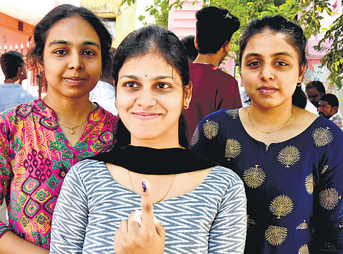 First time voters pose for a picture in Tirupati