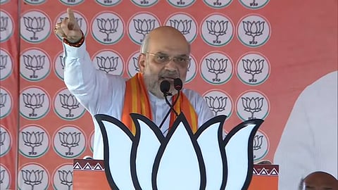 Union Home Minister and BJP leader Amit Shah addresses a poll rally in Siddharthnagar, Uttar Pradesh, on Thursday.