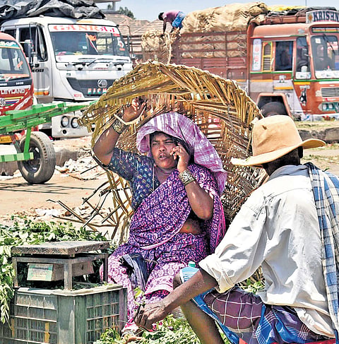 Street vendors braving the afternoon sun at Koyambedu in Chennai