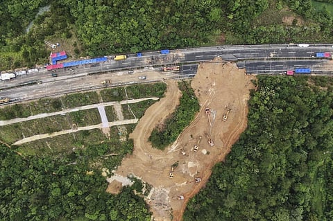 In this aerial photo released by Xinhua News Agency, rescue workers at the site of a collapsed section of a highway on the Meizhou-Dabu Expressway in Meizhou, southern China’s Guangdong Province on May 2, 2024.