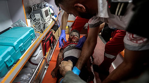 Palestinian medics evacuate a wounded boy in Israeli bombardment of the Gaza Strip by ambulance to the Hospital in Rafah, southern Gaza Strip.