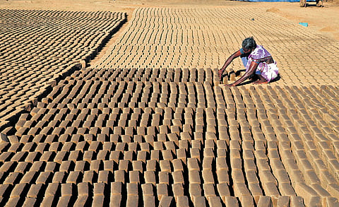 A labourer working at a brick kiln on the outskirts of Puducherry.