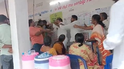 A YSRCP MLA is seen slapping a man for questioning him for jumping the que.