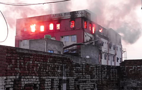 Smoke billows after a fire broke out at a hospital, in Baraut, Monday, May 27, 2024.