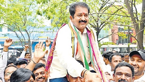 Supporters carry Congress candidate DT Srinivas
after he filed his papers in Bengaluru on Monday