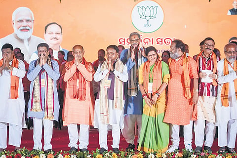 CM Mohan Majhi, Dy CMs KV Singh Deo and Pravati Parida, BJP state president Manmohan Samal, Union ministers Dharmendra Pradhan and Jual Oram with MLAs and MPs at the Sambardhana Sabha in Bhubaneswar on Sunday