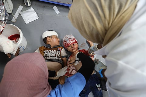 Palestinian children wounded in the Israeli bombardment of the Gaza Strip are treated in al-Aqsa Hospital in Deir al Balah, Sunday, June 9, 2024.