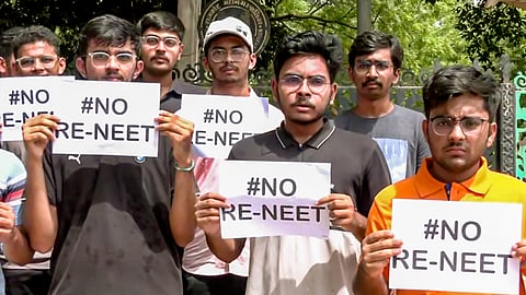 Students hold placards as they stage a protest against the re-examination of the NEET-UG exams, in Rajkot; Image used for representational purposes.