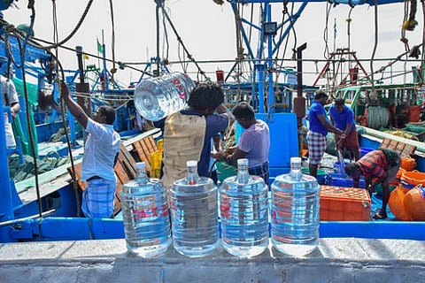 With the fish ban period ending, fisherman load drinking water and get ready to sail at Thoothukudi fishing harbour.