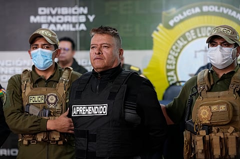 Bolivian police hold the detained Juan Jose Zuniga, former general commander of the Army, in La Paz, Bolivia, Wednesday, June 26, 2024. An apparent failed coup attempt erupted Wednesday in the country, and Zuniga appeared to be leading the rebellion.