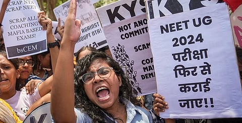 Members of various student organisations stage a protest against the alleged irregularities in the NEET-UG 2024 entrance exam result in New Delhi on Monday.