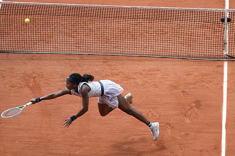 Coco Gauff of the US plays a shot against Tunisia's Ons Jabeur during their quarterfinal match of the French Open tennis tournament at the Roland Garros stadium in Paris, Tuesday, June 4, 2024.