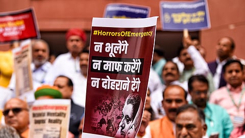 BJP MPs hold placards during a protest against the Emergency, at Parliament House in New Delhi on Wednesday.
