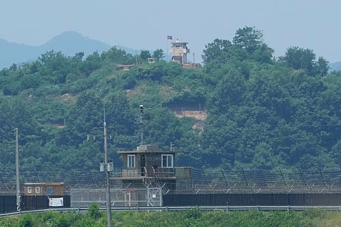 A North Korean military guard post, top, and a South Korean post, bottom, are seen from Paju, South Korea, near the border with North Korea, Tuesday, June 18, 2024.