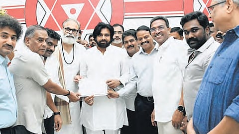 Jana Sena chief Pawan Kalyan with the newly elected party MLAs at his party office in Mangalagiri on Wednesday