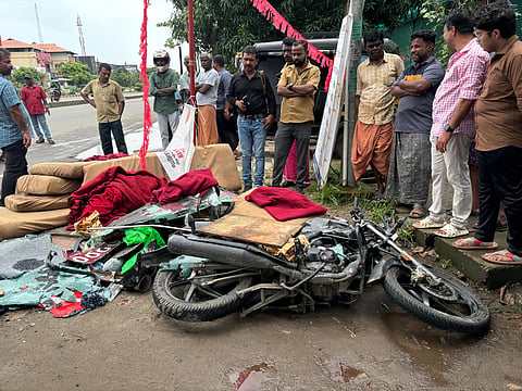 A motorist was killed after a private bus overturned and fell on him near Kochi