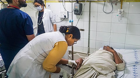 A patient admitted due to heat stroke and exhaustion undergoes treatment at LNJP hospital, in New Delhi, Wednesday, June 19, 2024.