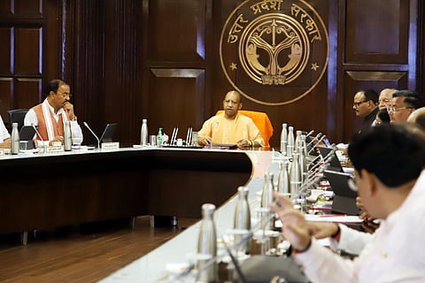 Uttar Pradesh Chief Minister Yogi Adityanath with his deputies Keshav Prasad Maurya and Brajesh Pathak during a state cabinet meeting, in Lucknow, Tuesday, June 25, 2024.