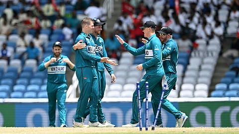 New Zealand's players congratulate New Zealand's Lockie Ferguson after dismissing Papua New Guinea's Chad Soper during the ICC men's Twenty20 World Cup 2024 group C cricket match between New Zealand and Papua New Guinea at Brian Lara Cricket Academy Stadium in Tarouba, Trinidad and Tobago on June 17, 2024.
