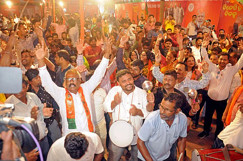 BJP supporters celebrate the party's victory in the Odisha Assembly and Lok Sabha election results, in Bhubaneswar on Tuesday.