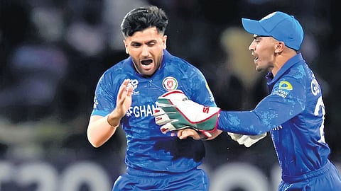 Fazalhaq Farooqi and Rahmanullah Gurbaz (L) have been standout performers for Afghanistan