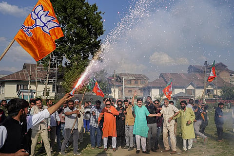 BJP supporters celebrate the party's lead during the counting of votes for the Lok Sabha elections, in Srinagar, Tuesday, June 4, 2024.