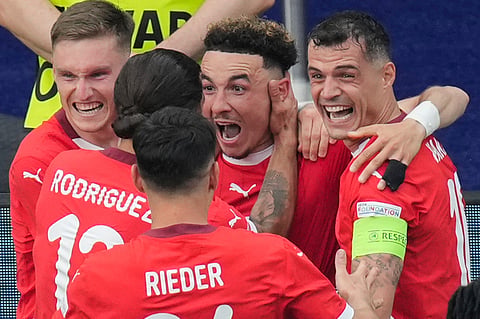 Switzerland's Ruben Vargas, center, celebrates with teammates after scoring his side's second goal during a round of sixteen match between Switzerland and Italy at the Euro 2024