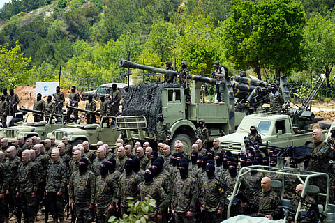 Fighters from the Lebanese militant group Hezbollah carry out a training exercise in Aaramta village in the Jezzine District, southern Lebanon.