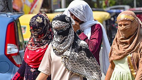 Representative image of people walking through the heat