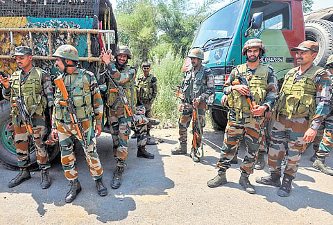 Army personnel near the site of encounter between security forces and terrorists at Saida Sukhal village in Hiranagar sector of Kathua district on Wednesday.