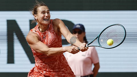 Aryna Sabalenka of Belarus plays a shot against Russia's Mirra Andreeva during their quarterfinal match of the French Open tennis tournament at the Roland Garros stadium in Paris, June 5, 2024.
