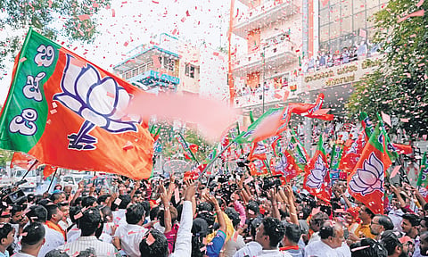 The BJP office wears a festive look, with supporters waving party flags and cheering, after the announcement of results of the Lok Sabha polls, in Bengaluru on Tuesday