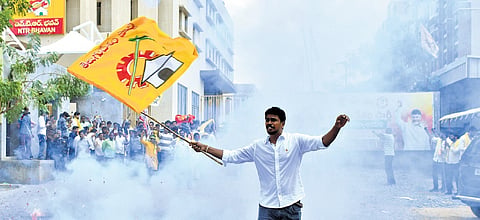 TDP activists burst crackers in joy at Mangalagiri party office