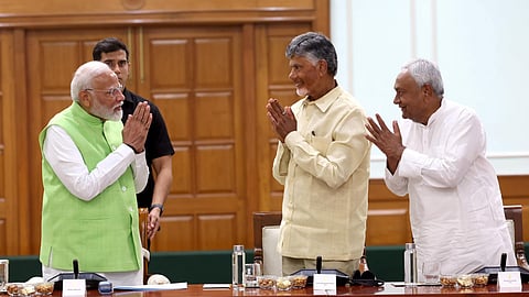 Prime Minister Narendra Modi with TDP chief N Chandrababu Naidu and JD(U) chief Nitish Kumar.