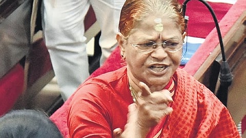 Lone BJP councillor Uma Anandan walks out of GCC meeting at Ripon Building on Monday, in protest against the Justice Chandru committee report.