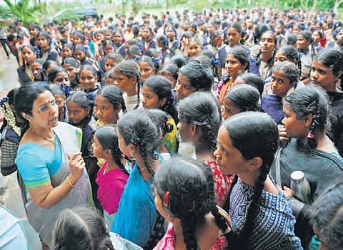 NTR Trust managing trustee Nara Bhuvaneswari with students of NTR Model School at Challapalli on Friday