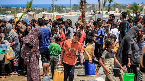 Gazans filling up water in Rafah, the southern city Israel described as Hamas's last stronghold