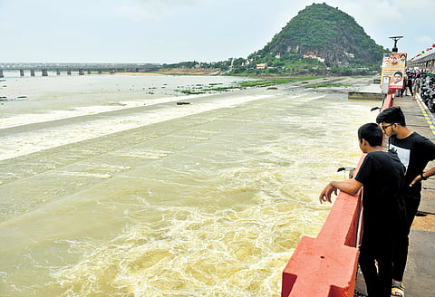 With heavy inflows, officials are releasing surplus water from the Prakasam Barrage into the sea in Vijayawada on Saturday