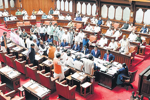 Opposition members protest in the well of the Council targeting the State Government over the MUDA and ST Corporation row, on Thursday.