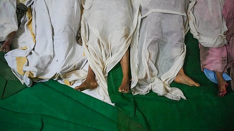 Bodies of victims of the Hathras stampede lie at Bagla District Hospital in Hathras.