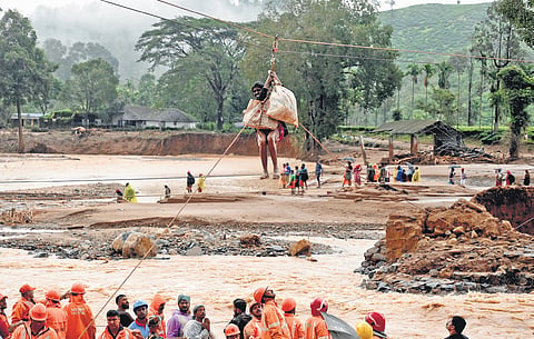 Rescue officials use zip lines to transport survivors from Mundakai in Wayanad to a safer location on Tuesday