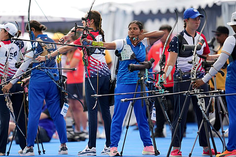 India's Ankita Bharat, center, competes during the women's archery individual ranking round at the 2024 Summer Olympics, Thursday, July 25, 2024, in Paris, France.