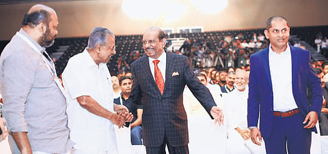 Chief Minister Pinarayi Vijayan shakes hands with Lulu Group chairman Yusuffali M A at the inaugural function of the International GenAI Conclave at Lulu Hyatt Bolgatty International Convention Centre on Thursday. Industries Minister P Rajeeve and IBM senior vice-president Dinesh Nirmal are also seen
