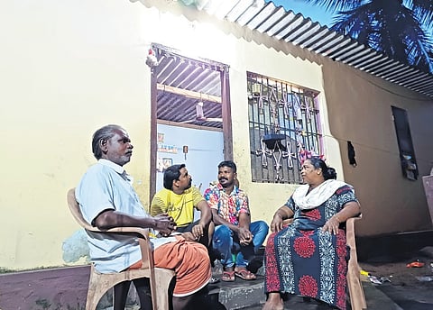 Conservancy workers Muthu, Rajan and Suresh with Rajan’s mother Muthuleksmi in front of his house at Cheriyathura in Thiruvananthapuram