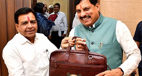 Madhya Pradesh Chief Minister Mohan Yadav with Deputy CM and Finance Minister Jagdish Devda before presentation of the annual budget in the State Legislative Assembly during the ongoing Monsoon session, in Bhopal, Wednesday, July 3, 2024.