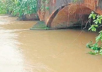 Water in Jalaka river flowing above the danger mark at Mathani in Basta block