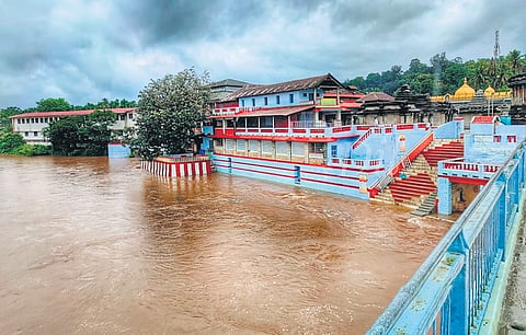 Tunga river overflows above the danger level at bathing ghat, near Sri Sharadamba temple, in Sringeri