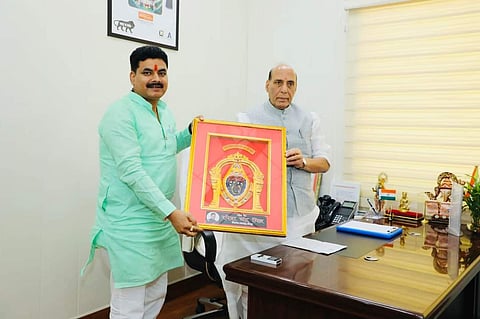 BJP's Badlapur MLA Ramesh Chandra Mishra with Union Defence Minister Rajnath Singh.