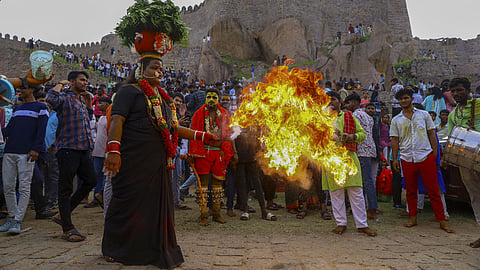 A transgender person performs during the 'Ashada Bonalu'' festival celebrations, at the Golconda Fort, in Hyderabad, Sunday, July 7, 2024.